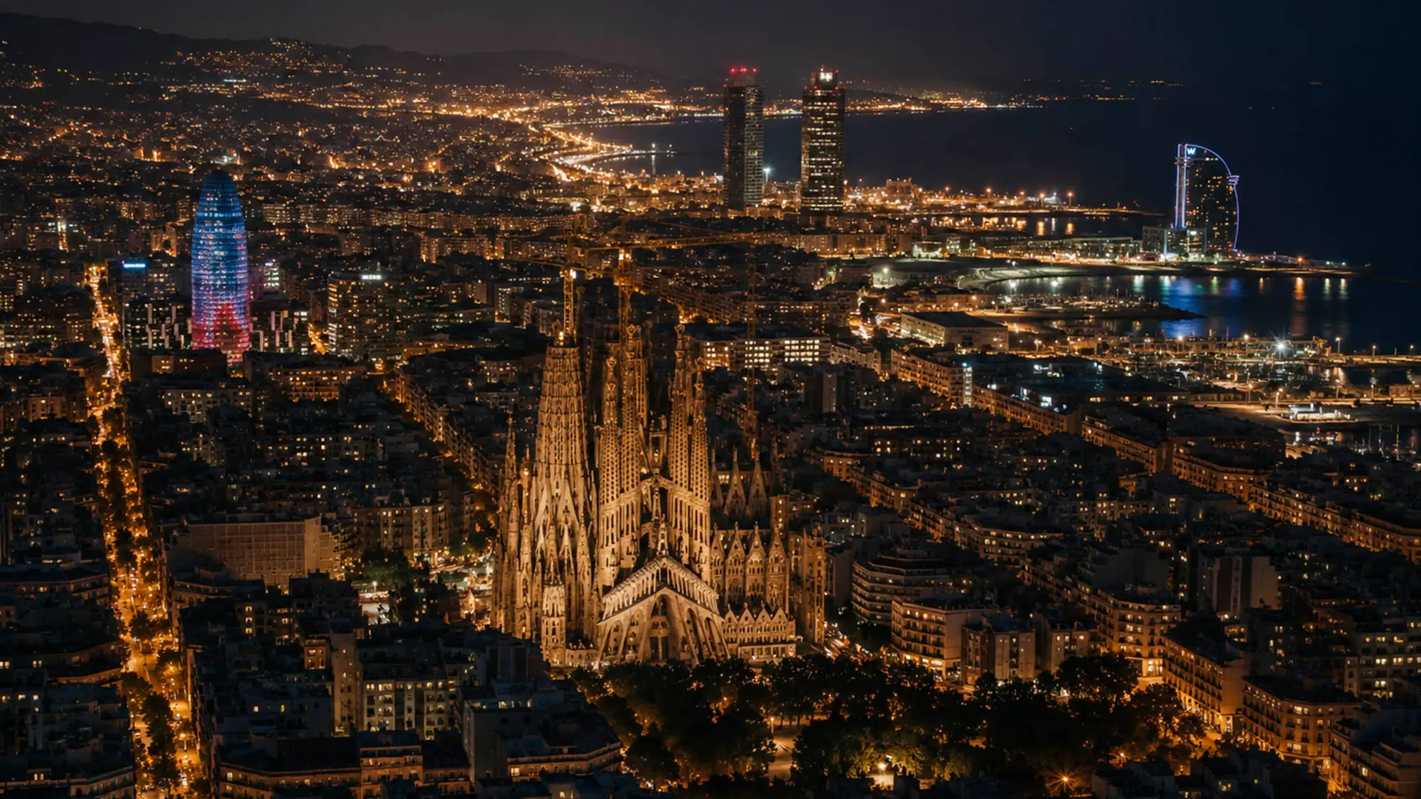 Barcelona at night — the Sagrada Família and city lights seen from above